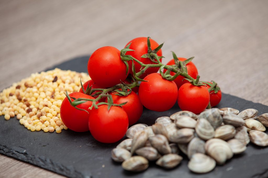 Fregola sarda con vongole lupini - Padelle Volanti