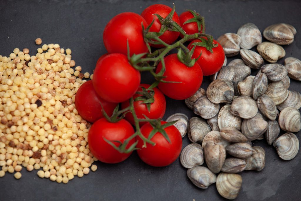 Fregola sarda con vongole lupini - Padelle Volanti